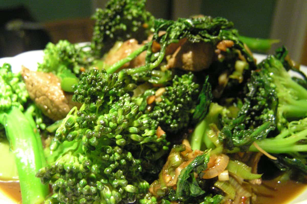 Plate of beef and broccoli stir-fry with glossy sauce served over steamed white rice