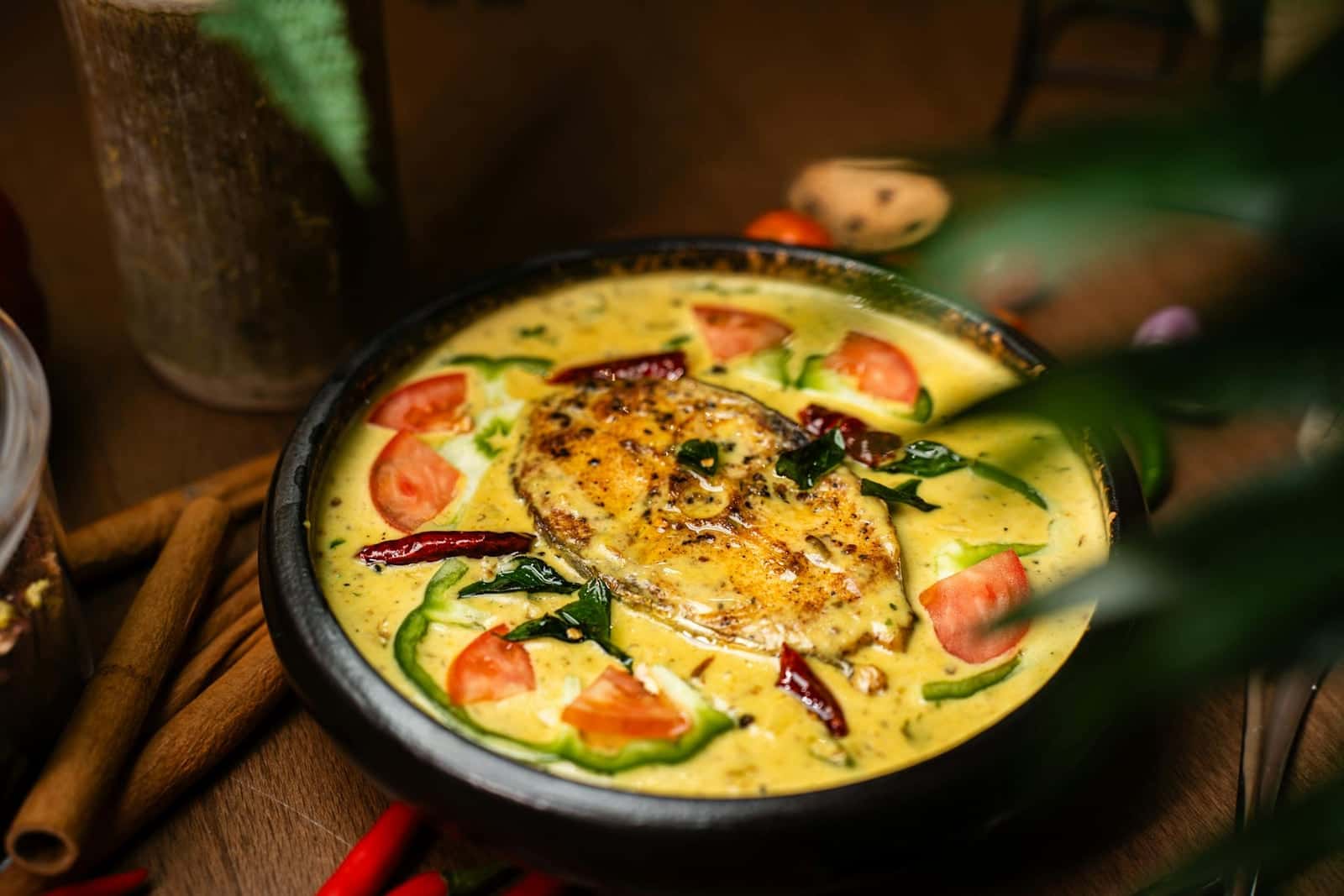 Goan fish curry in a yellow coconut sauce with tomatoes and fresh herbs