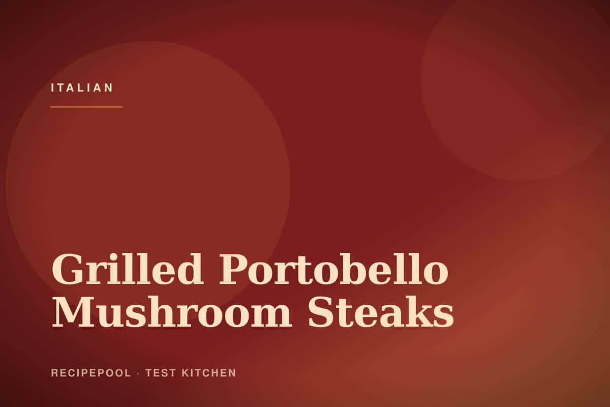 Grilled portobello mushroom steaks on a plate with balsamic glaze and fresh herbs