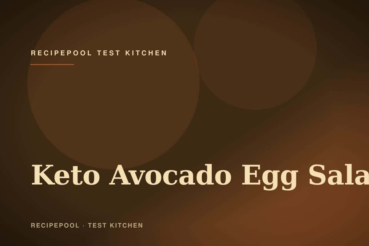 Bowl of creamy keto avocado egg salad with herbs and a sprinkle of paprika