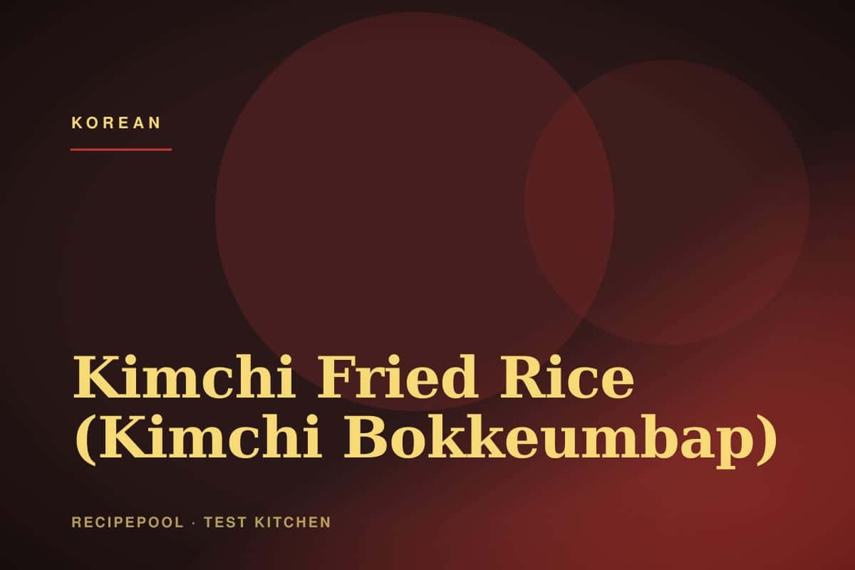 Plate of kimchi fried rice topped with a sunny-side-up egg and sesame seeds