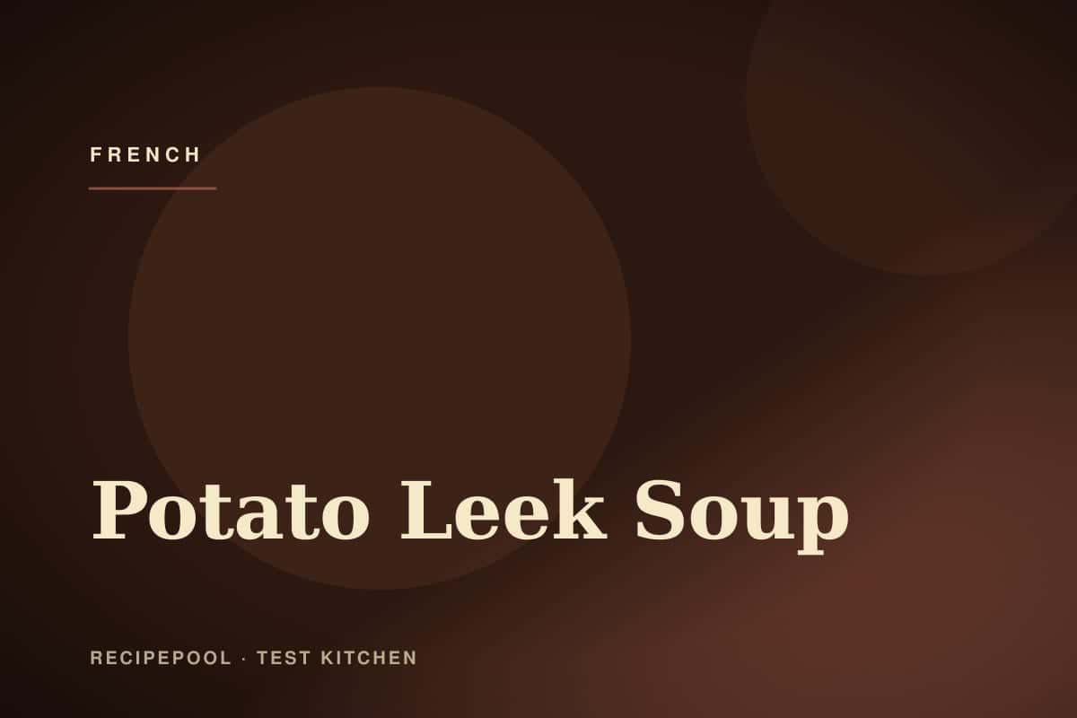 Bowl of velvety potato leek soup garnished with chives and cream