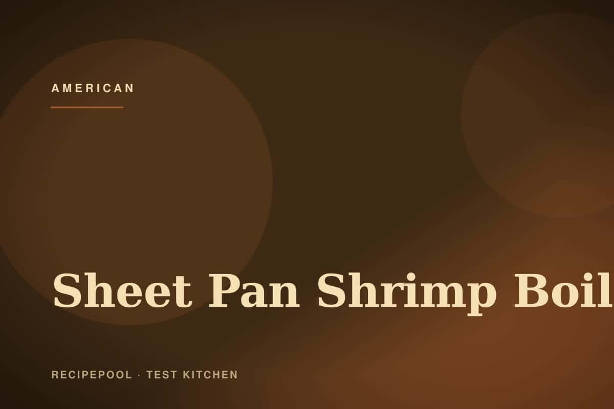 Sheet pan shrimp boil with corn, sausage, potatoes, and lemon wedges