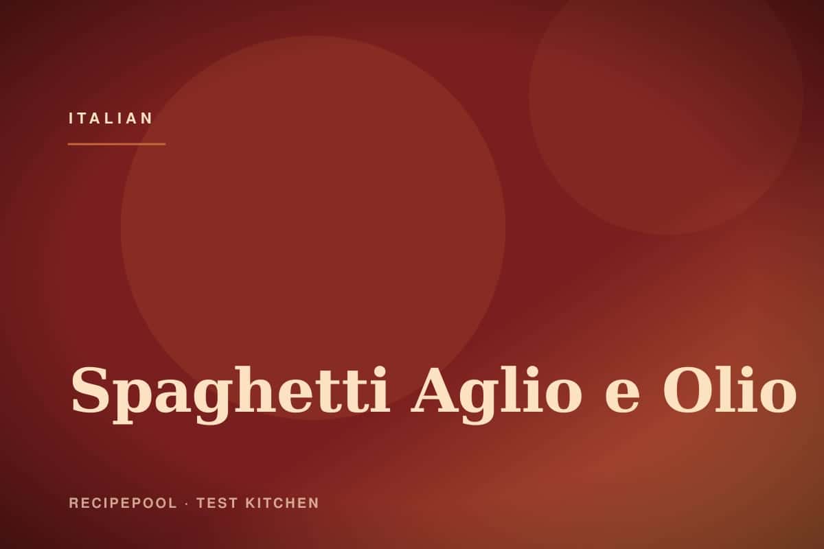 Spaghetti aglio e olio with golden garlic chips and red pepper flakes in a pan