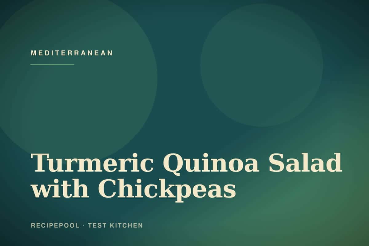 Bowl of golden turmeric quinoa salad with chickpeas, vegetables, and lemon dressing