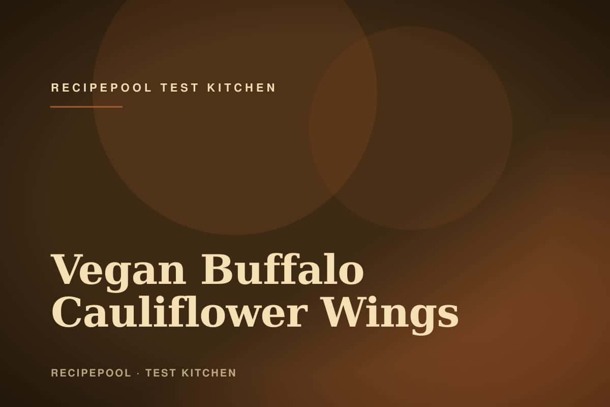 Crispy vegan buffalo cauliflower wings on a plate with ranch dip and celery sticks