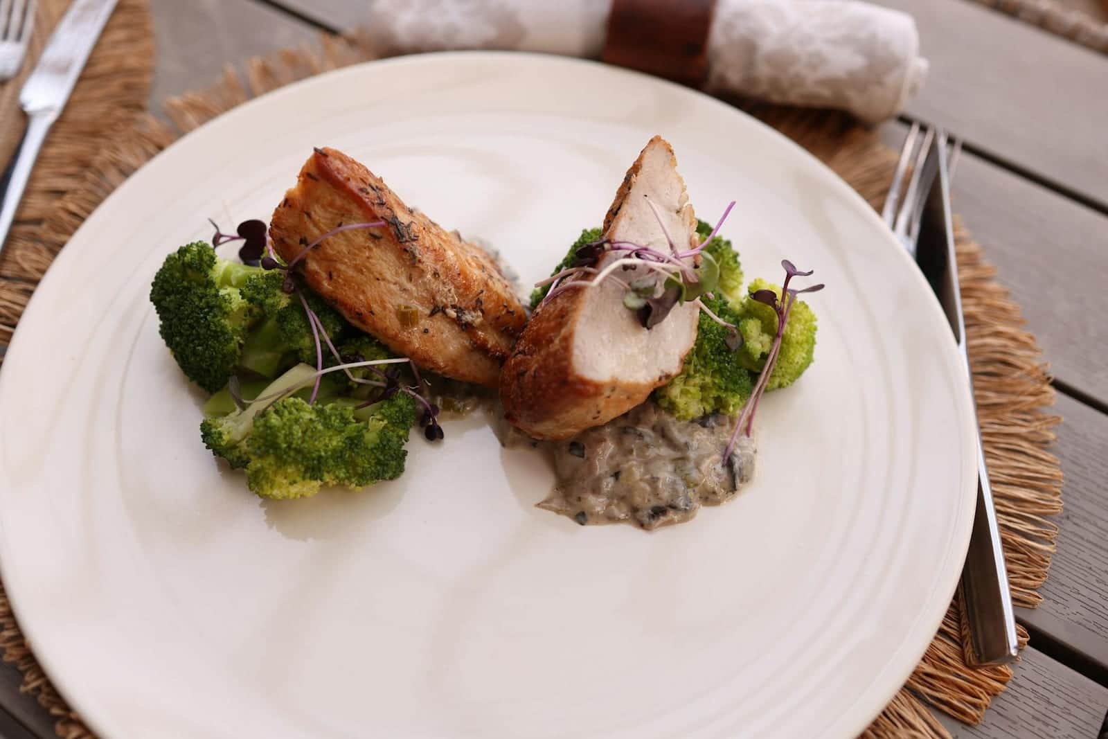 Broccoli cheddar stuffed chicken-style plate with chicken, broccoli, and sauce