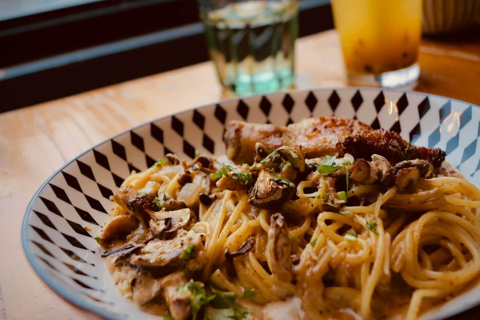 Cajun chicken pasta with spaghetti, chicken, mushrooms, and creamy spiced sauce