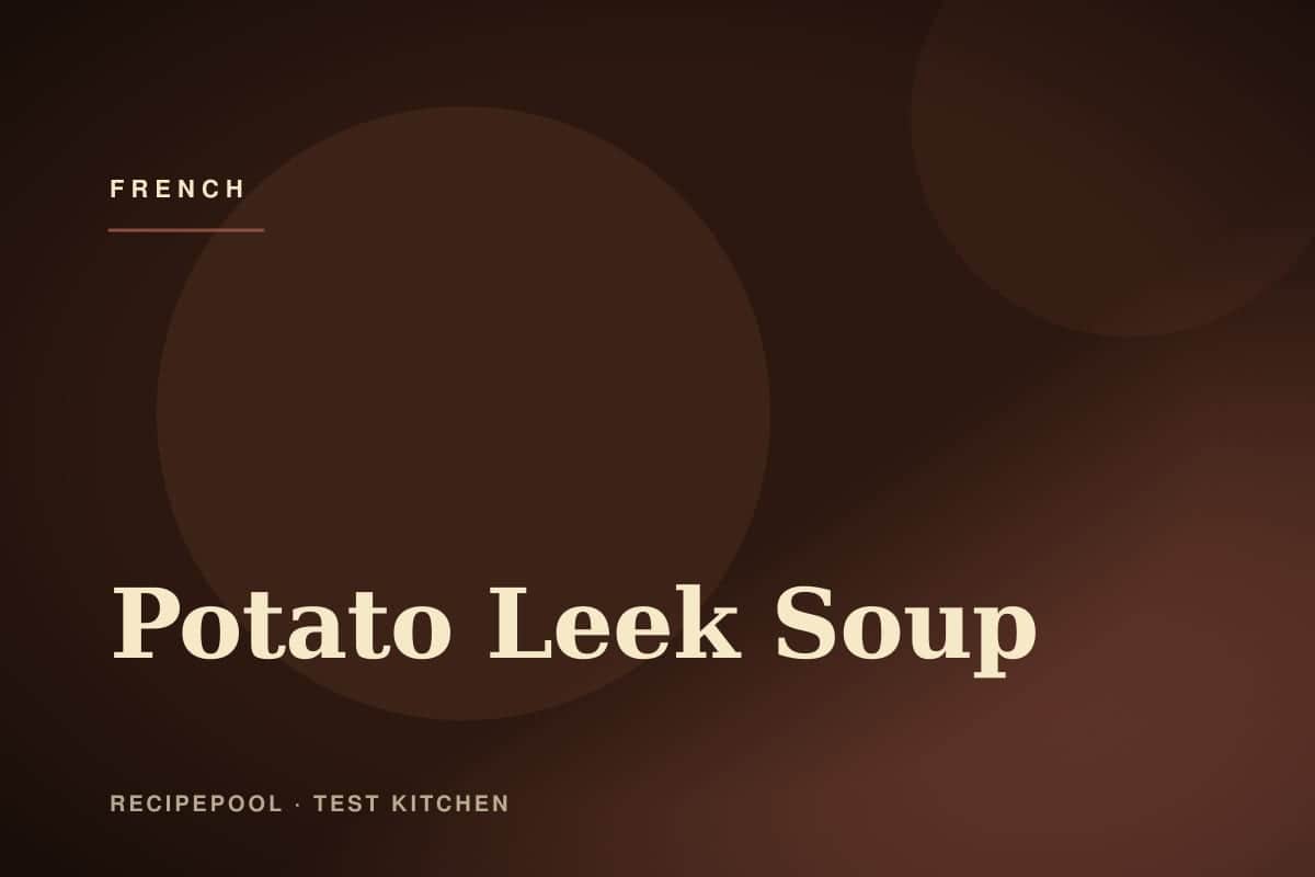 Bowl of velvety potato leek soup garnished with chives and cream