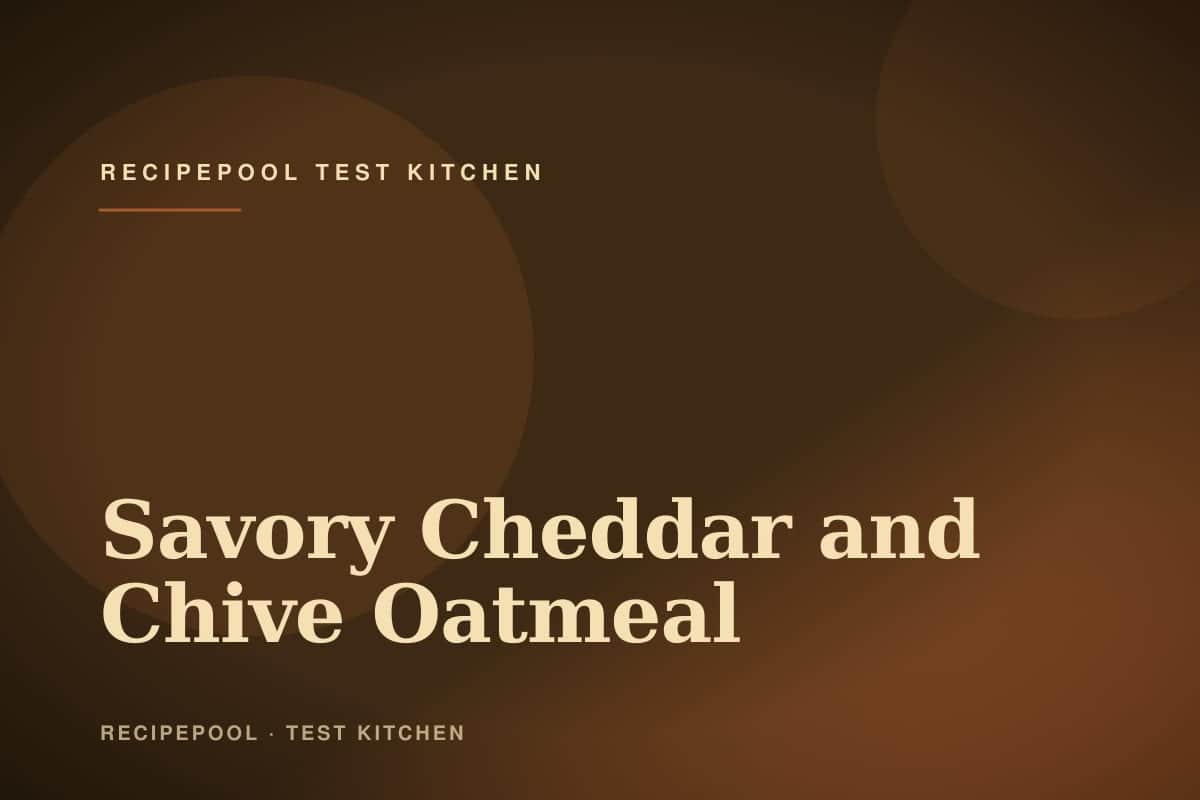 Bowl of creamy savory oatmeal with melted cheddar, topped with a fried egg and crispy bacon crumbles