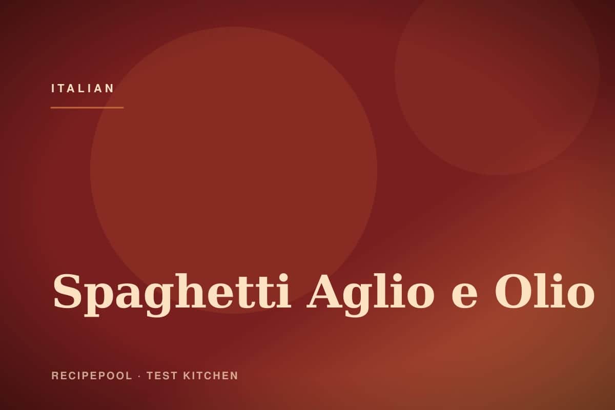 Spaghetti aglio e olio with golden garlic chips and red pepper flakes in a pan