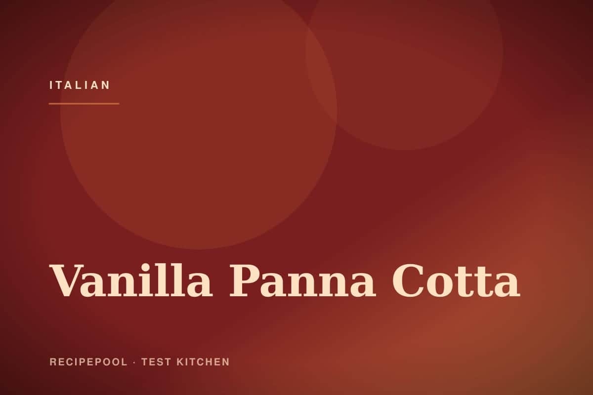 Vanilla panna cotta unmolded on a plate with fresh berry compote
