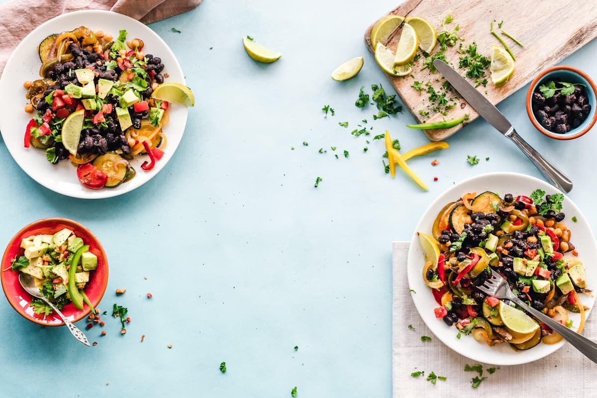 Quick weeknight dinner spread on a wooden table with multiple colorful dishes