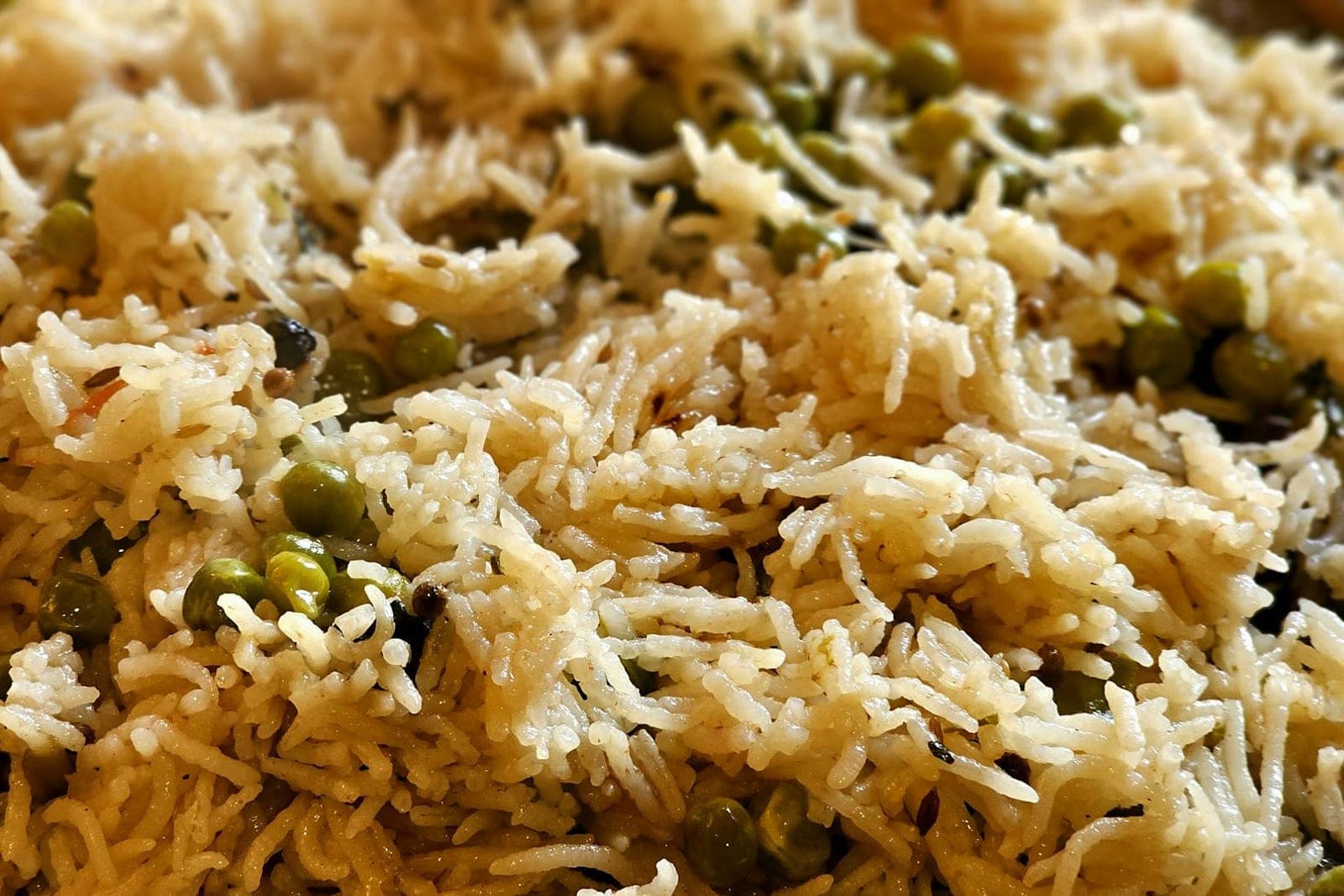 Arabic rice with vermicelli-style pilaf, basmati grains, peas, and toasted noodles