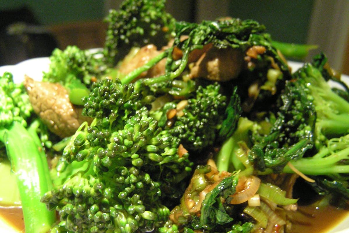 Plate of beef and broccoli stir-fry with glossy sauce served over steamed white rice