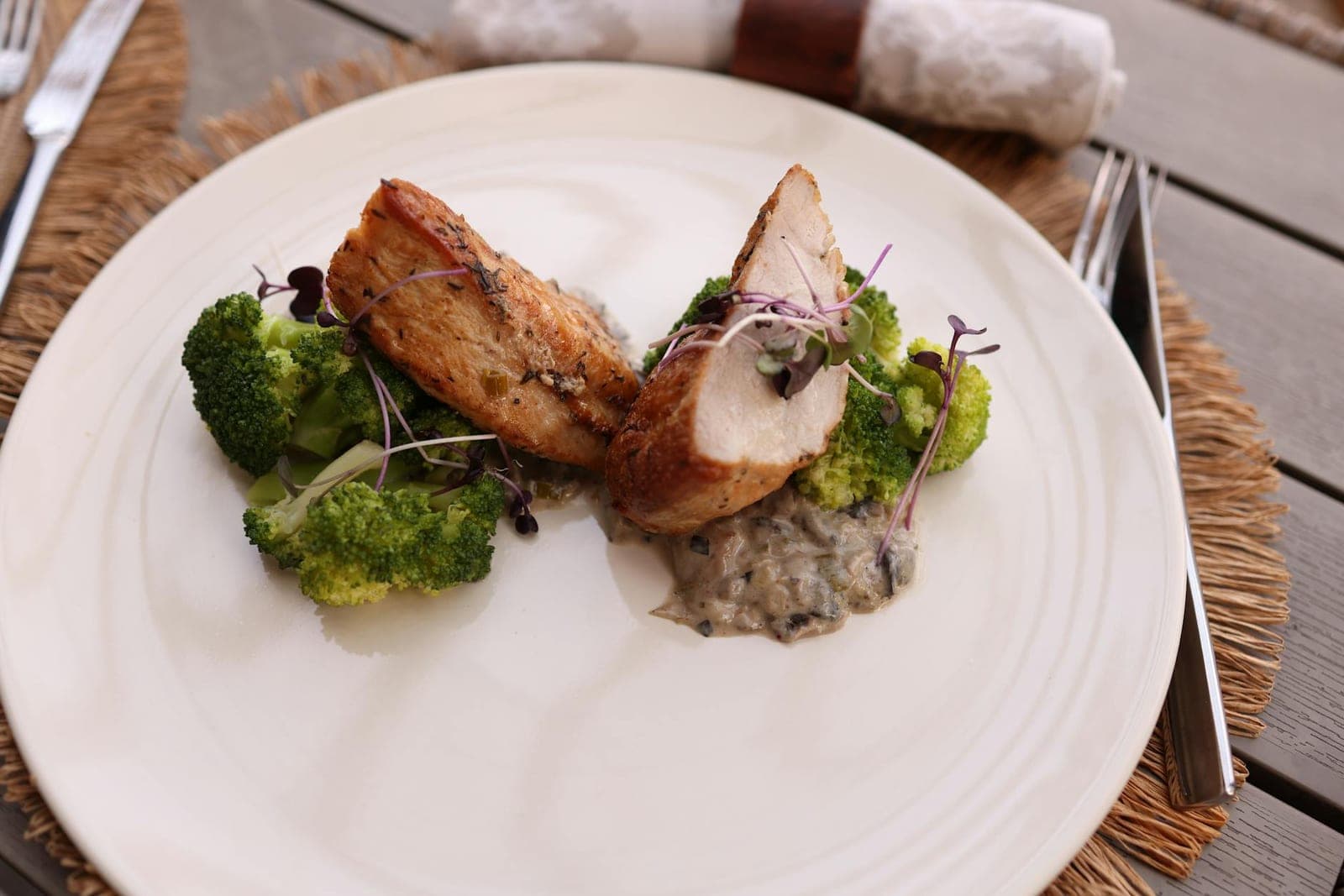 Broccoli cheddar stuffed chicken-style plate with chicken, broccoli, and sauce