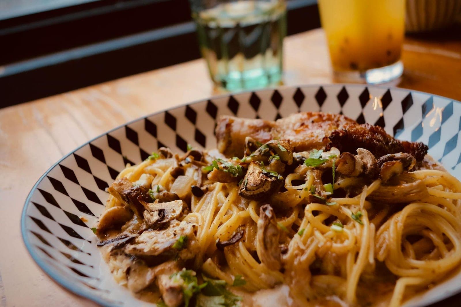 Cajun chicken pasta with spaghetti, chicken, mushrooms, and creamy spiced sauce