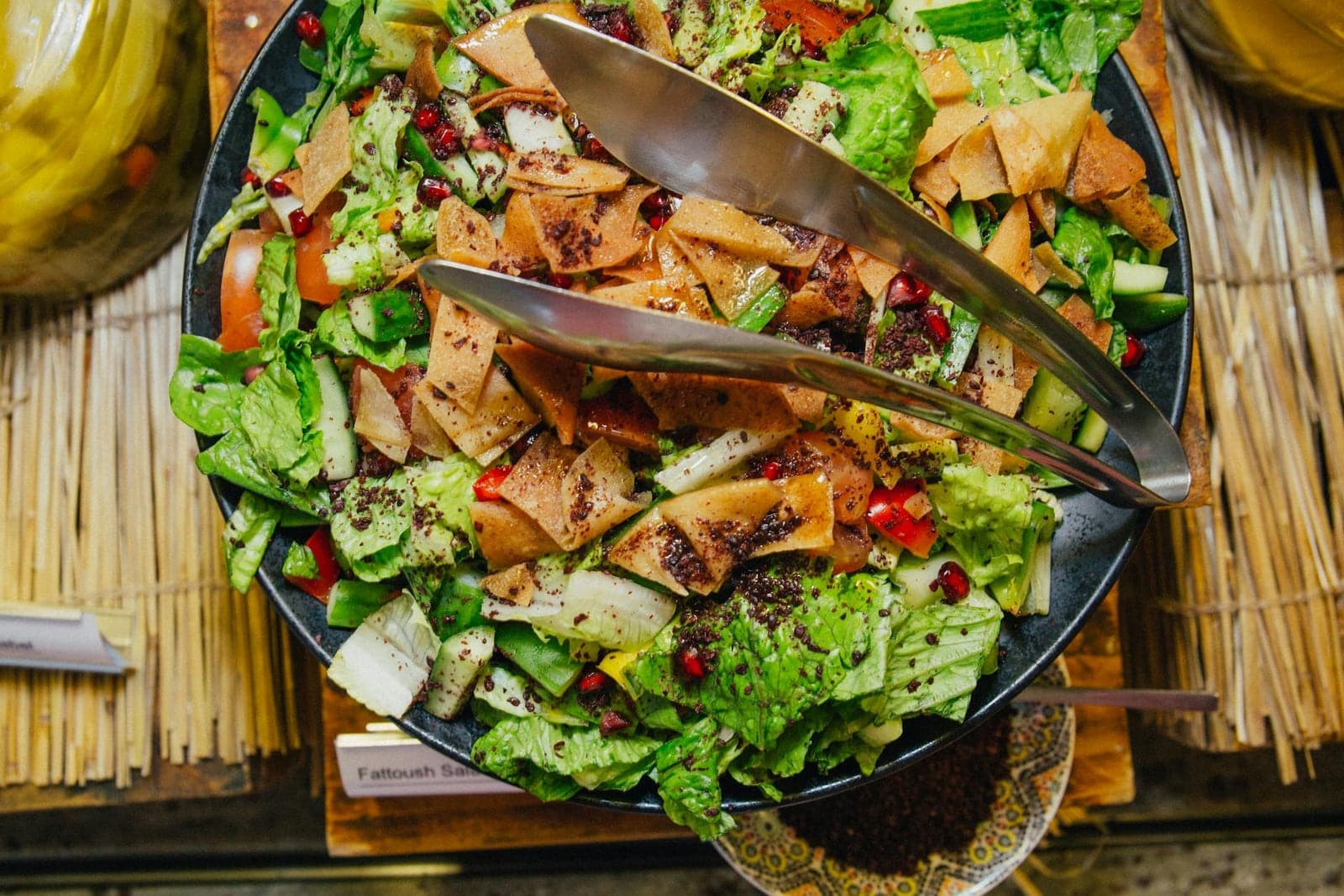 Fattoush salad with crisp vegetables, toasted pita, herbs, and bright dressing