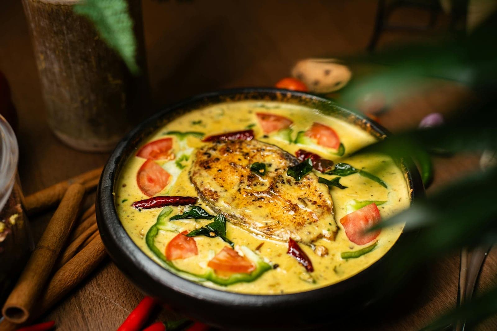 Goan fish curry in a yellow coconut sauce with tomatoes and fresh herbs