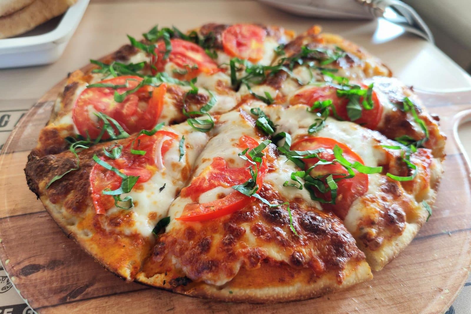 Homemade Margherita pizza with tomato, basil, and melted cheese