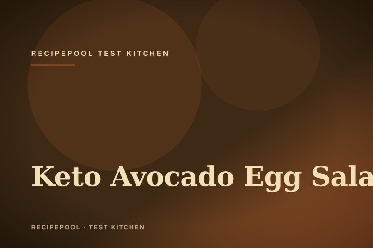 Bowl of creamy keto avocado egg salad with herbs and a sprinkle of paprika