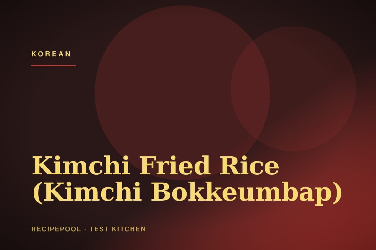 Plate of kimchi fried rice topped with a sunny-side-up egg and sesame seeds