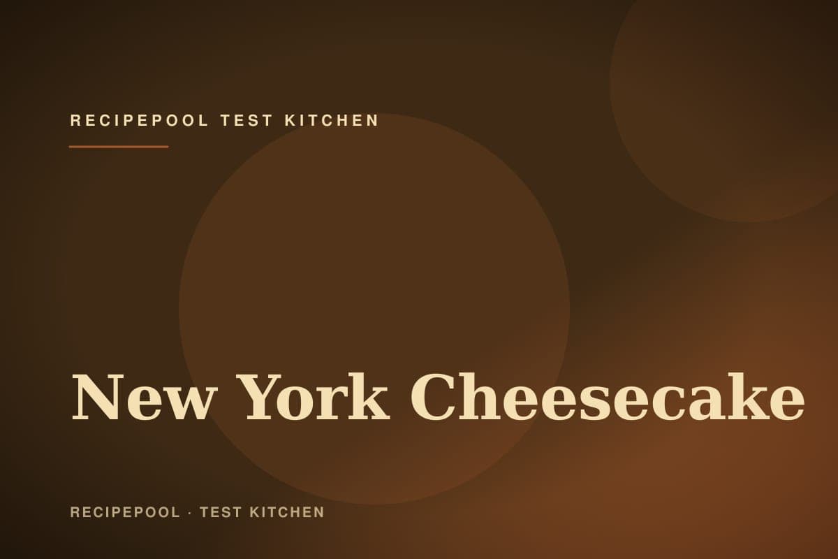 Tall New York cheesecake with smooth top on a cake stand