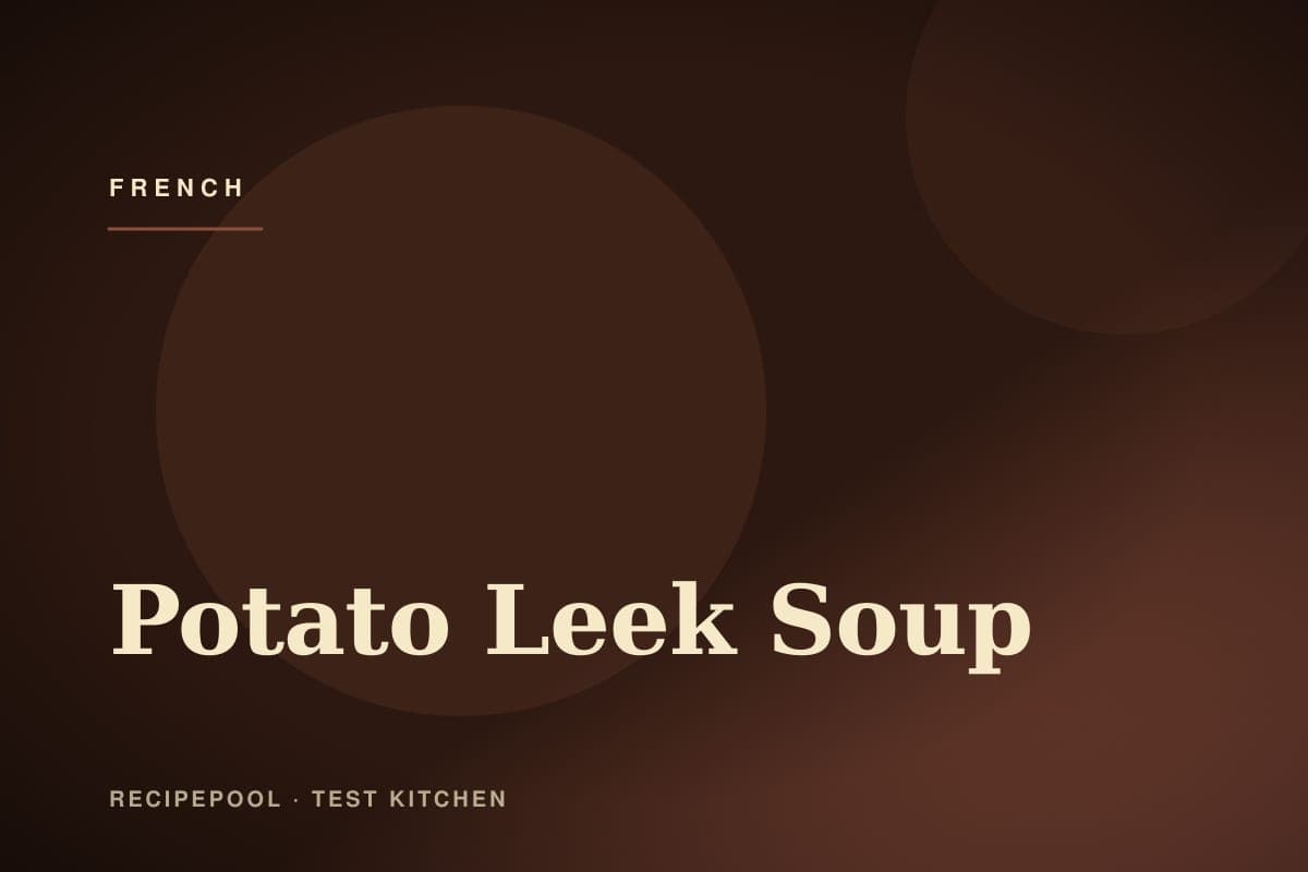 Bowl of velvety potato leek soup garnished with chives and cream