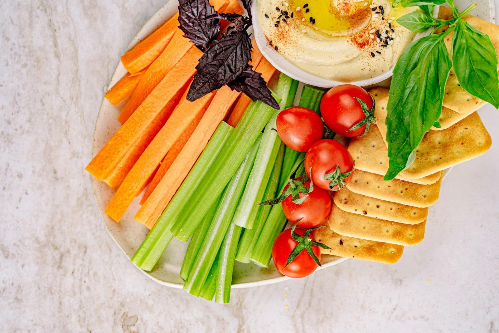 Greek yogurt ranch dip platter with fresh vegetables, crackers, and a creamy herb dip