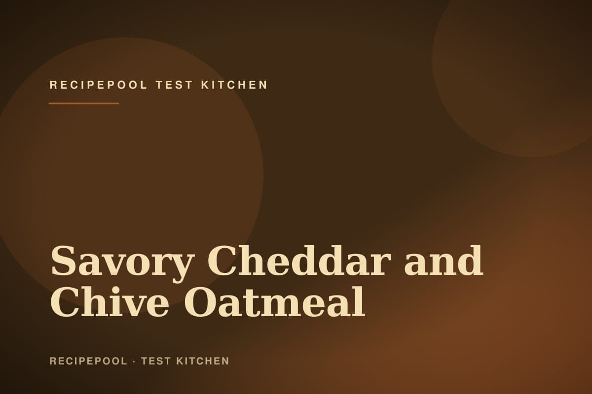 Bowl of creamy savory oatmeal with melted cheddar, topped with a fried egg and crispy bacon crumbles