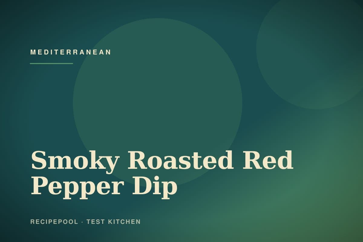 Bowl of smoky roasted red pepper dip with walnuts and olive oil drizzle
