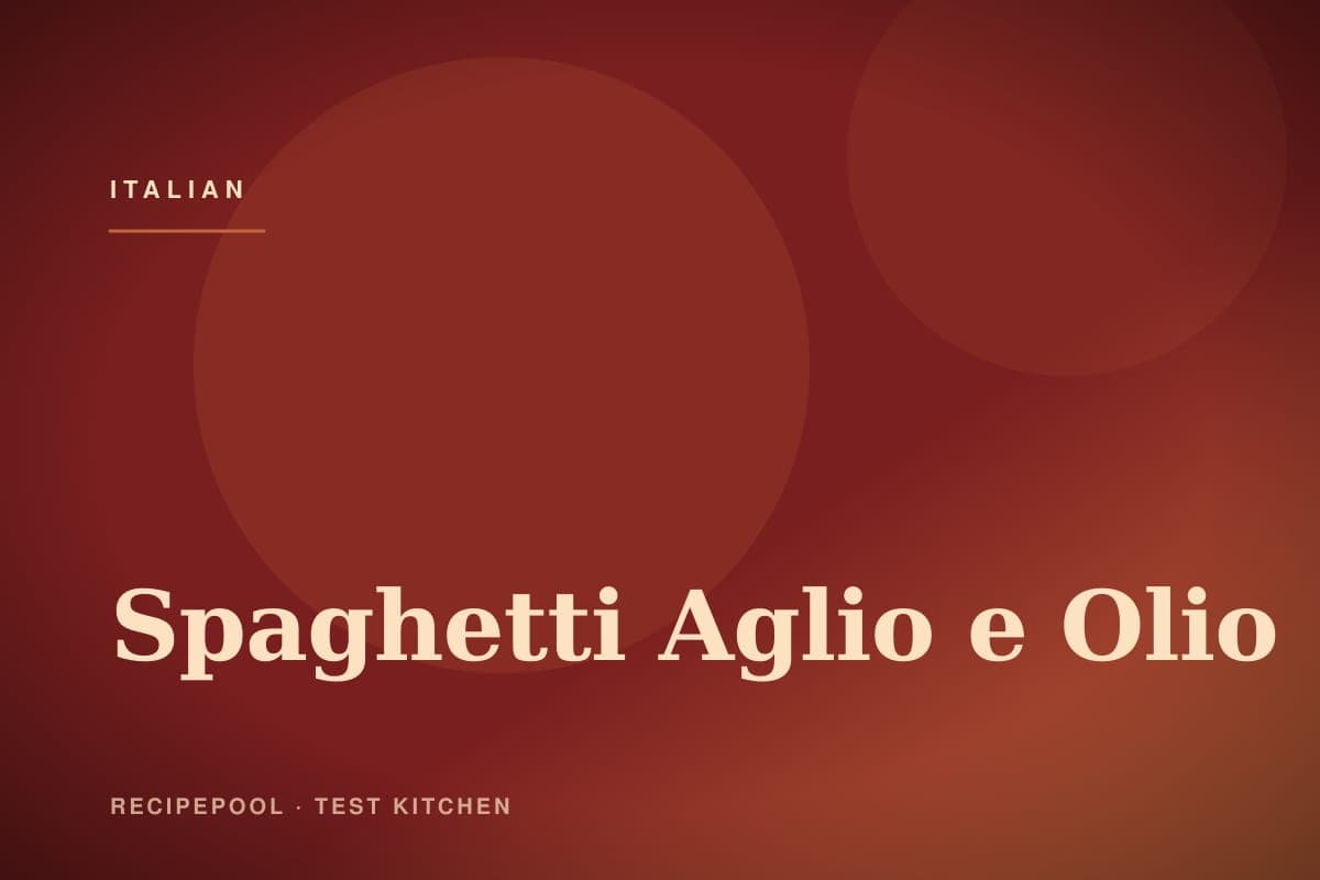 Spaghetti aglio e olio with golden garlic chips and red pepper flakes in a pan