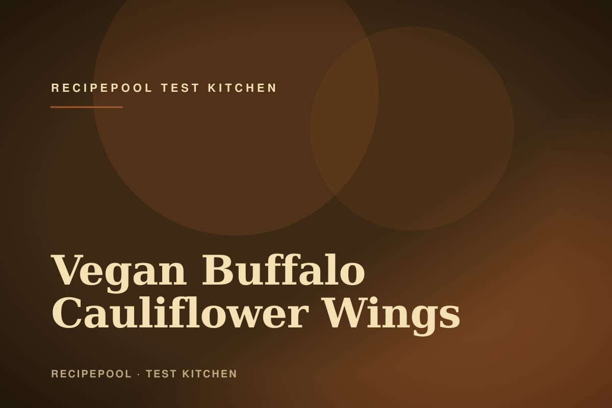 Crispy vegan buffalo cauliflower wings on a plate with ranch dip and celery sticks