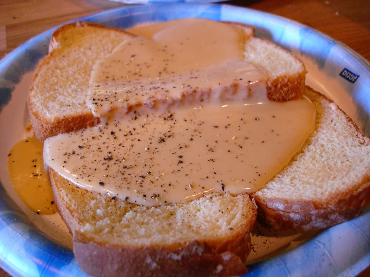 Welsh rarebit on toast with glossy melted cheese sauce and blistered top