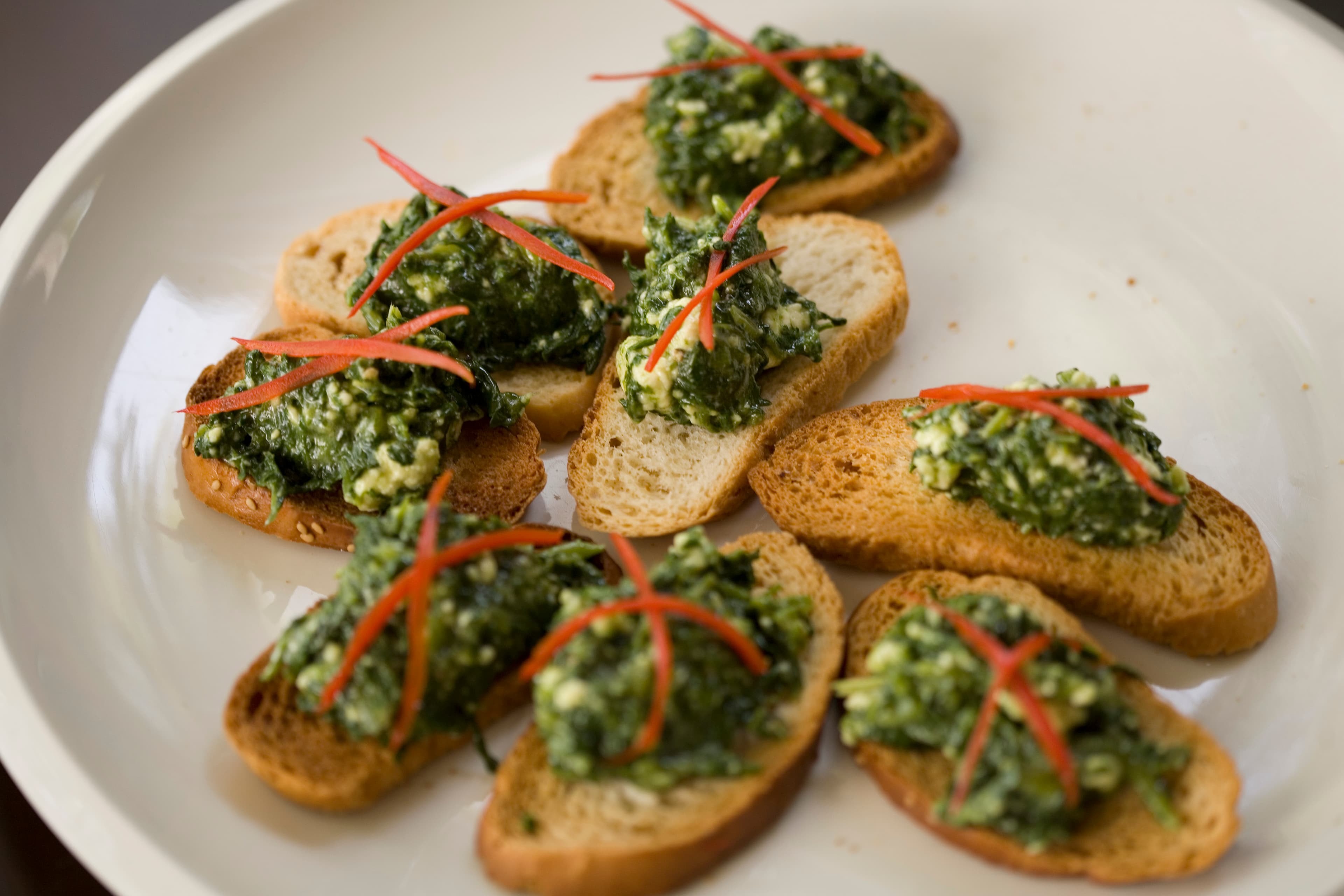 Spring pea and ricotta crostini with mint and lemon zest