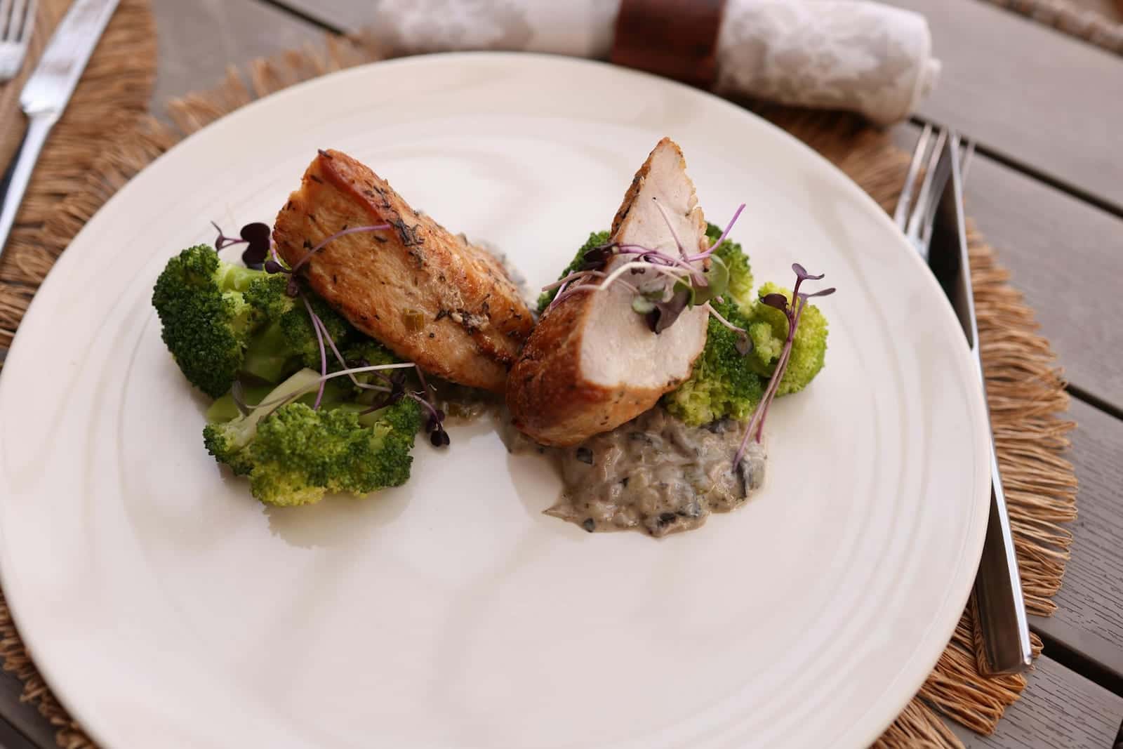 Broccoli cheddar stuffed chicken-style plate with chicken, broccoli, and sauce