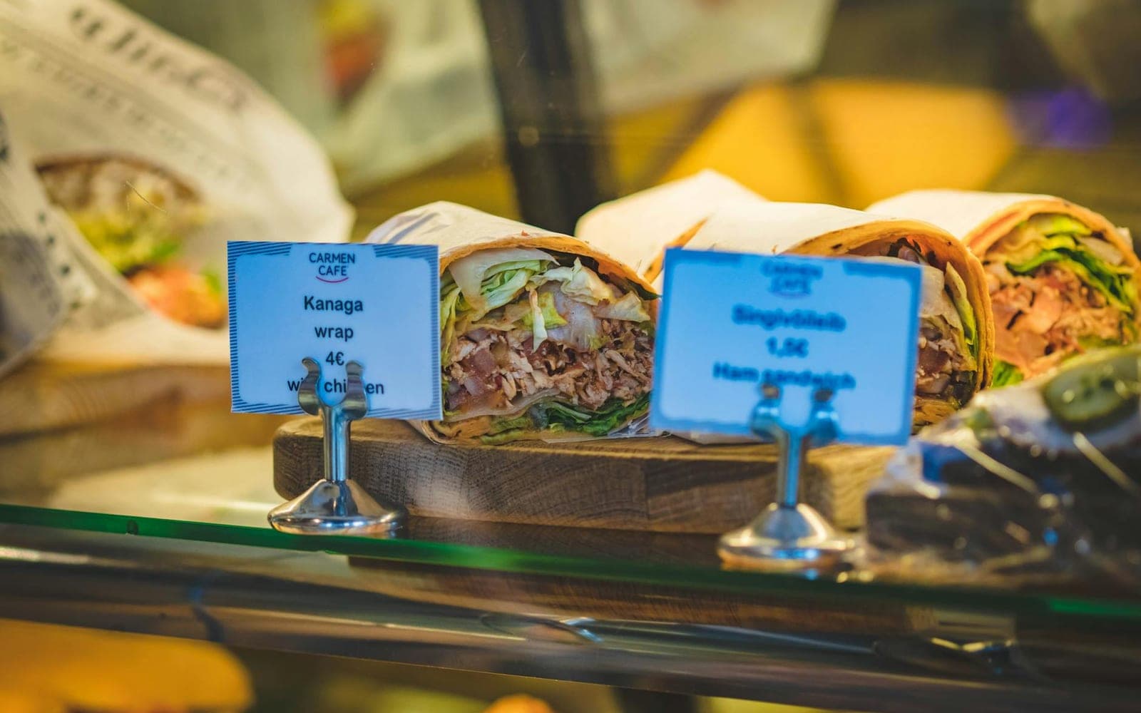Chicken Caesar wrap sandwiches displayed at a cafe counter
