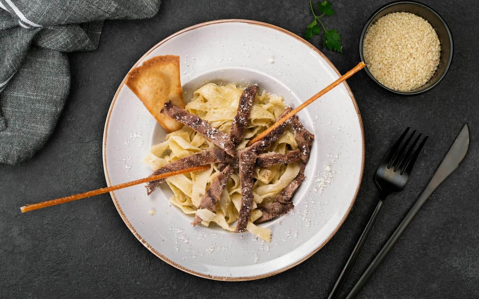 Creamy mushroom stroganoff-style pasta with mushrooms and sauce on a white plate