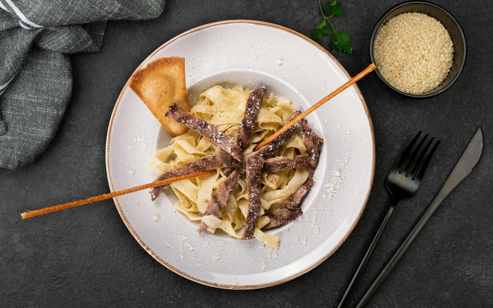 Creamy mushroom stroganoff-style pasta with mushrooms and sauce on a white plate