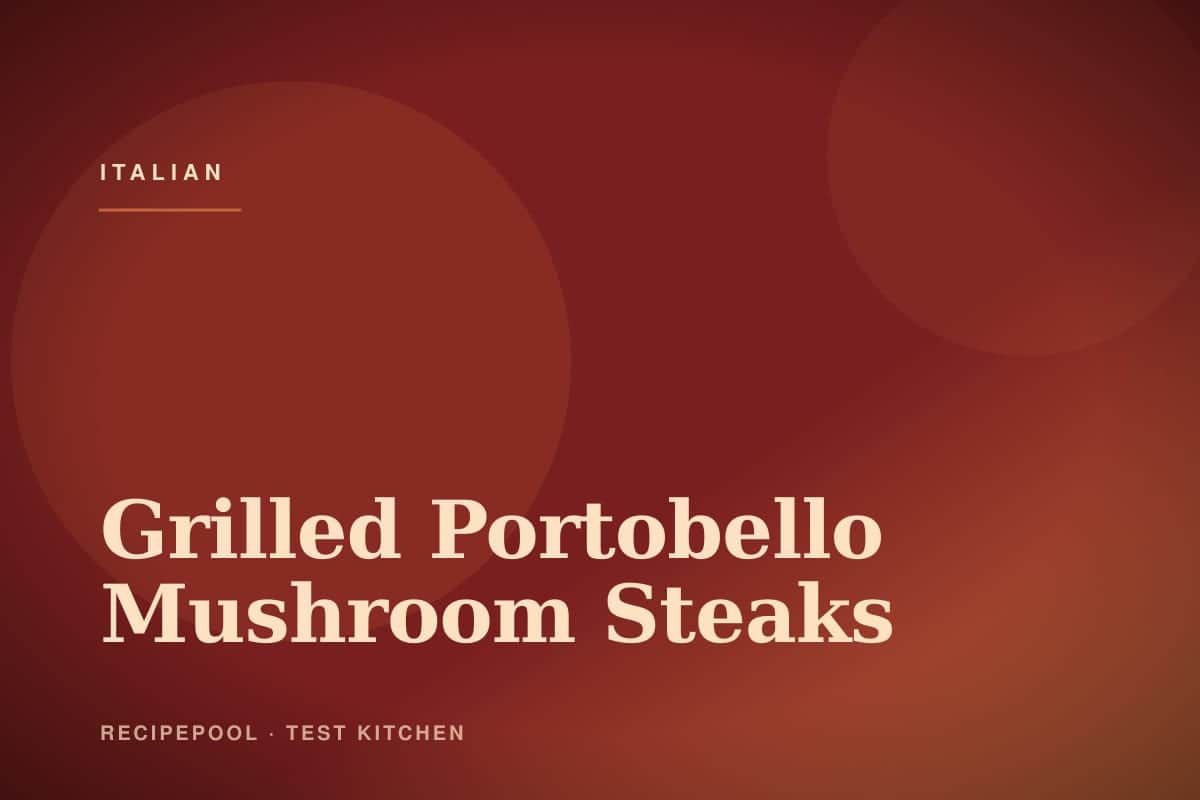 Grilled portobello mushroom steaks on a plate with balsamic glaze and fresh herbs