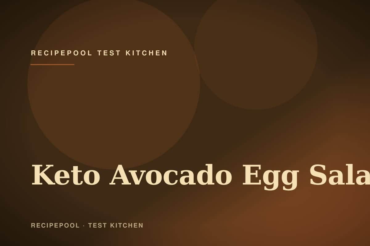 Bowl of creamy keto avocado egg salad with herbs and a sprinkle of paprika