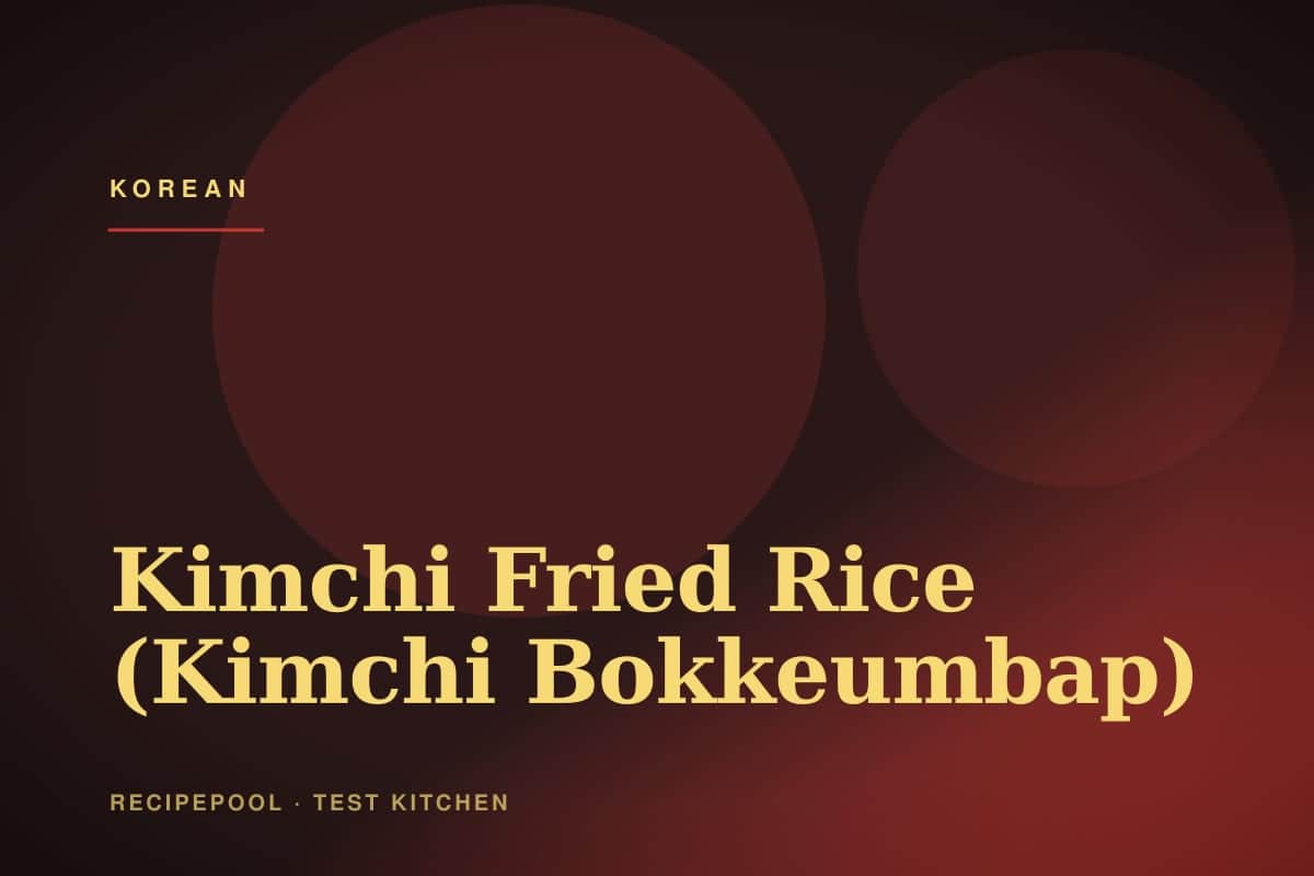 Bowl of kimchi fried rice topped with a fried egg and sesame seeds