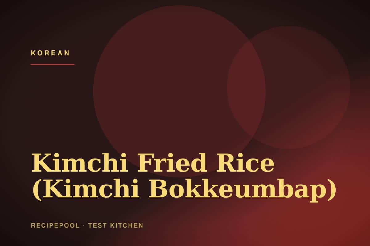 Plate of kimchi fried rice topped with a sunny-side-up egg and sesame seeds