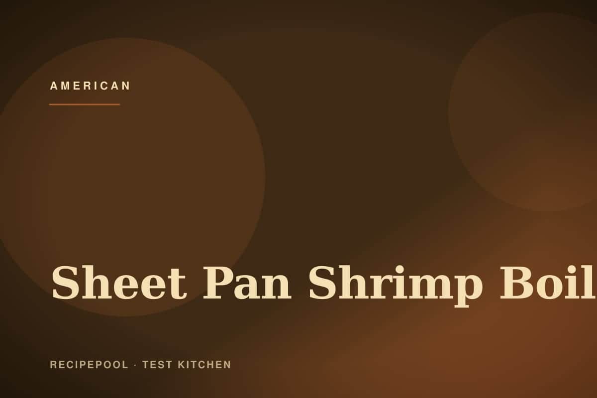 Sheet pan shrimp boil with corn, sausage, potatoes, and lemon wedges