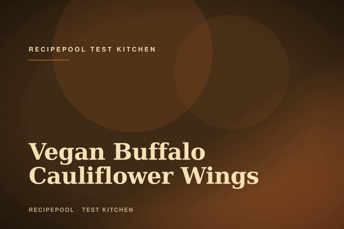 Crispy vegan buffalo cauliflower wings on a plate with ranch dip and celery sticks